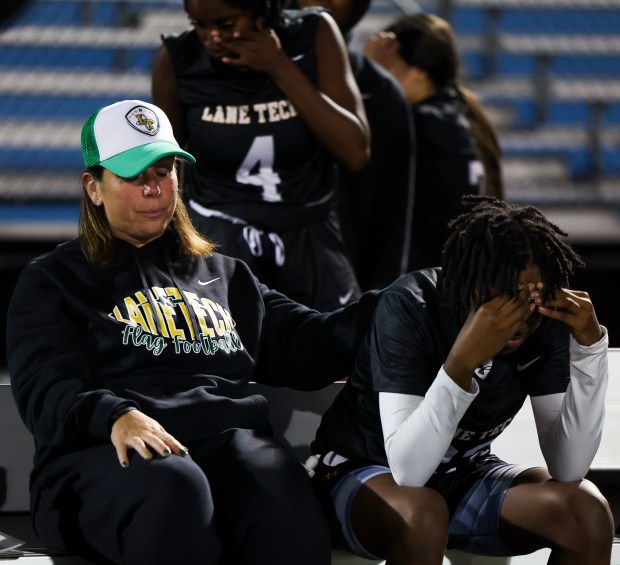 Lane Tech coach Caroline Schwartz consoles Makayla Brown after their loss to Guilford High School in the quarterfinal playoff game at Willowbrook High School in Villa Park on Oct. 18, 2024. (Eileen T. Meslar/Chicago Tribune)