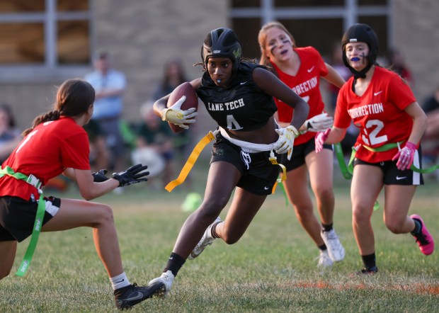 Lane Tech's Angel Ativie tries to avoid Resurrection's defense during their game at Resurrection College Prep High School on Sept. 11, 2024. (Eileen T. Meslar/Chicago Tribune)