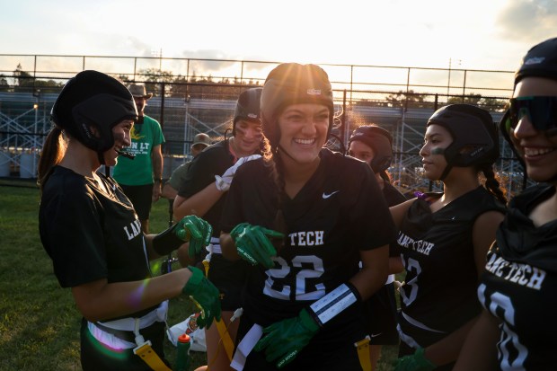 Lane Tech's Faith Galik, left, Sofia Pagones, Gaby Bahena and Vanessa Ramirez celebrate a touchdown during their game against Round Lake at Willowbrook High School on Aug. 29, 2024. Three years ago, Chicago Public League partnered with the Chicago Bears and others to launch a girls high school flag football league. Last year, the league included more than 100 schools across the state. This February, the IHSA board of directors added flag football to its roster of sanctioned sports. (Eileen T. Meslar/Chicago Tribune)