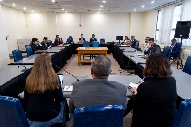 Holly Ambuehl, director of policy and government affairs at Forefront, from left, lobbyist Josh Witkowski and Amy Williams, assistant general counsel for the Secretary of State's office, testify during a hearing of the Ethics & Elections Committee about a bill backed by Secretary of State Alexi Giannoulias that would require lobbyists to disclose client pay, April 10, 2024, at the Stratton Building in Springfield. (Brian Cassella/Chicago Tribune)