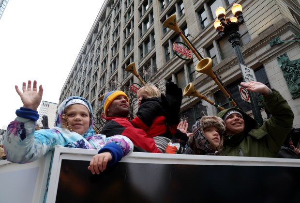 People wave during the 90th Chicago Thanksgiving Parade on Nov. 28, 2024. (Antonio Perez/Chicago Tribune)