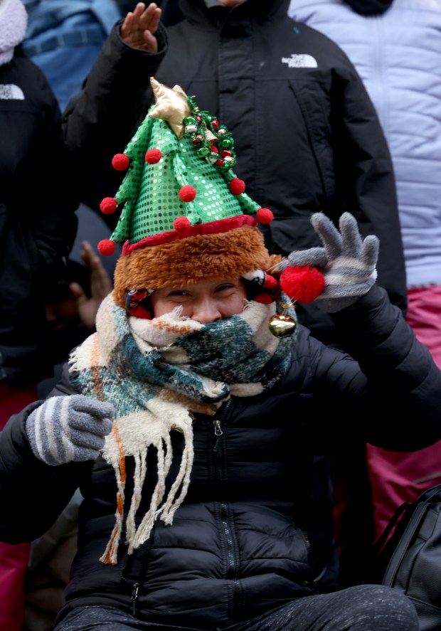 A person wrapped up for the cold weather watches the 90th Chicago Thanksgiving Parade on Nov. 28, 2024. (Antonio Perez/Chicago Tribune)