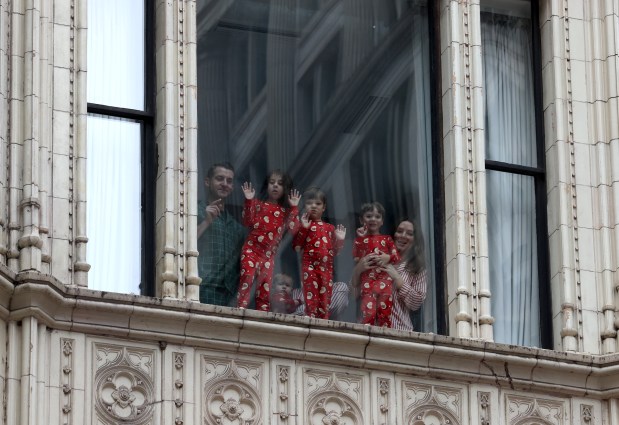 Pajama-clad youngsters watch the 90th Chicago Thanksgiving Parade from inside on Nov. 28, 2024. (Antonio Perez/Chicago Tribune)