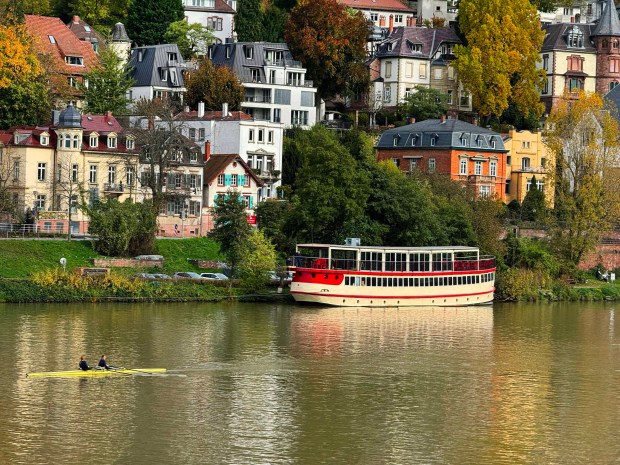 Two Heidelberg women row in a scull along the Neckar River and near a river cruiser. (Alan Behr/TNS)