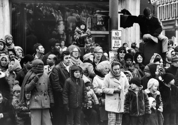 Children and their families watch the annual Christmas parade on Michigan Avenue on Nov. 28, 1970, in Chicago. This was the first year the city of Chicago put on the parade. (Michael Budrys/Chicago Tribune)