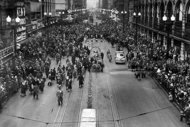 An overhead view looking north from Van Buren Street, shows the crowds on State Street during the annual Santa Claus parade in November 1947. (Chicago Tribune historical photo)