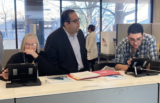 Lake County Clerk Anthony Veta oversees two members of his office's staff during early voting. (Steve Sadin/For the Lake County News-Sun)