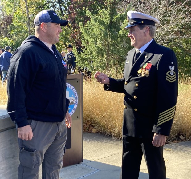 Waukegan Veterans Day keynote speaker Ron Gardella, right, and last year's speaker, Matt Burleson, talk after the ceremony. Both are veterans. (Steve Sadin/For the Lake County News-Sun)