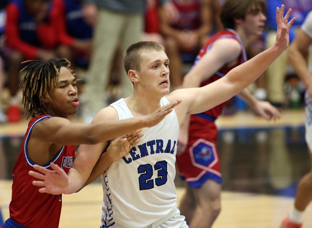 Burlington Central's Jacob Johnson (23) and Dundee-Crown's Rasheed Trice (1) battle for space in the paint in the second quarter of a Fox Valley Conference game Wednesday, Dec. 11, 2024 in Burlington. (H. Rick Bamman / The Beacon-News)