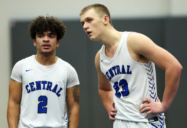 Burlington Central's Caden West (2) and Jacob Johnson (23) chat at half court during a Fox Valley conference game against Dundee-Crown Wednesday, Dec. 11, 2024 in Burlington. (H. Rick Bamman / The Beacon-News)