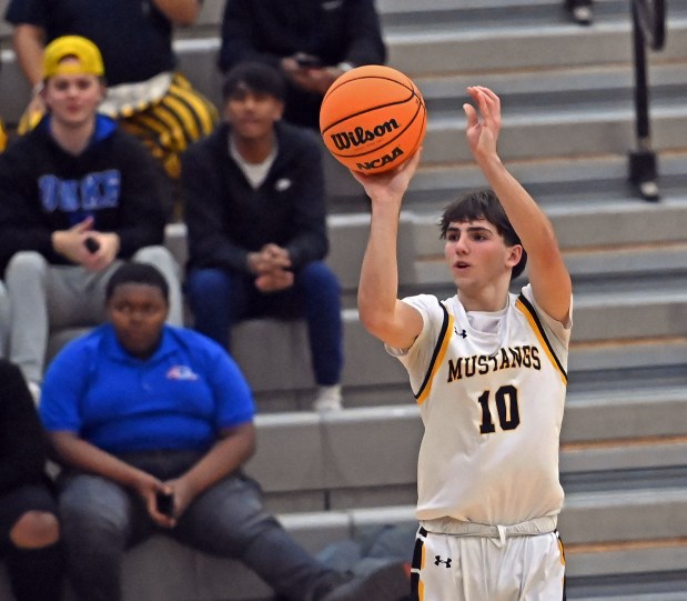 Metea Valley's Tyler Miller shoots a three pointer. Metea Valley defeated East Aurora, 70-39, in a boys basketball game, Tuesday, Dec. 3, 2024, in Aurora, Illinois. (Jon Langham/for the Beacon-News)