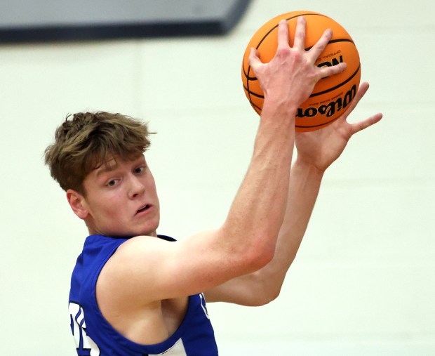 Geneva's Hudson Kirby (25) rebounds in the second quarter against Bartlett during a nonconference game in Bartlett on Tuesday, Dec. 3, 2024.(H. Rick Bamman/for the Beacon-News)