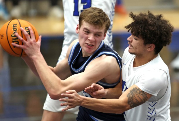 Burlington Central's Caden West (2) covers Lake Park's Frederick Battaglia (33) in the third quarter during a non-conference game Monday, Dec. 16, 2024 in Burlington. (H. Rick Bamman / The Beacon-News)