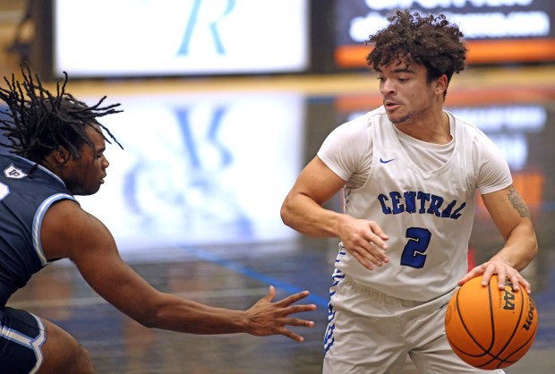 Burlington Central's Caden West (2) works around Lake Park's Jamarious Bassette (2) in the second quarter during a non-conference game Monday, Dec. 16, 2024 in Burlington. (H. Rick Bamman / The Beacon-News)