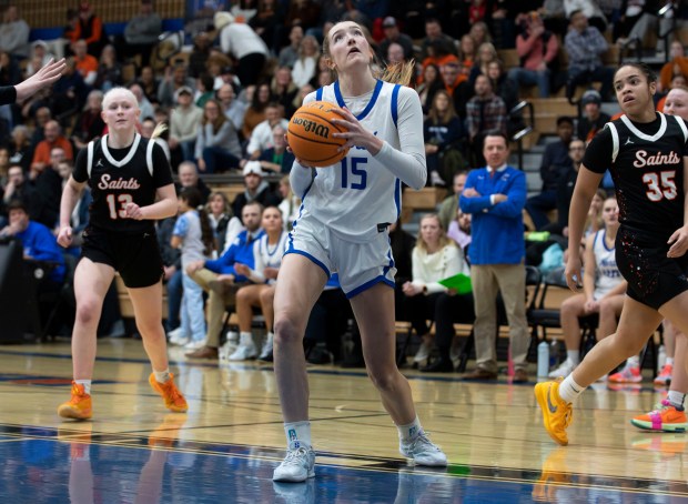 St. Charles North's Bronwyn How (15) prepares to shoot during a game in St. Charles on Friday, Dec. 20, 2024. (Nate Swanson / for the Beacon-News)