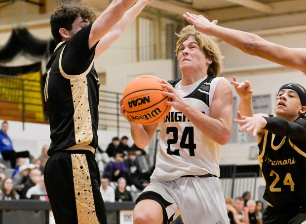 Kaneland's Luke Reinert (24) moves in for a shot against Sycamore during a game at home in Maple Park on Wednesday, Dec. 11, 2024. (Mark Black / for the Beacon-News)