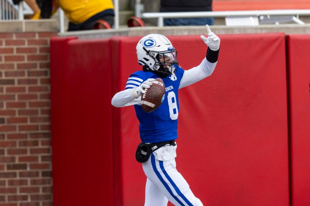 Geneva's Finnegan Weppner (8) celebrates after his touchdown reception against East St. Louis in the Class 6A state championship game at Hancock Stadium in Normal on Saturday, Nov. 30, 2024. (Vincent D. Johnson / for The Beacon-News)