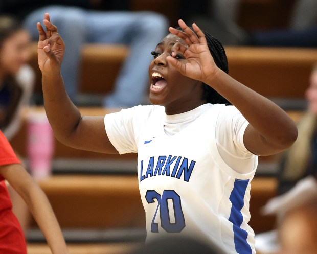 Larkin's Sanaii McPherson (20) calls an offensive play against East Aurora in the first quarter during a Upstate Eight conference game in Elgin on Thursday, Dec. 5, 2024.(H. Rick Bamman/for the Beacon-News)