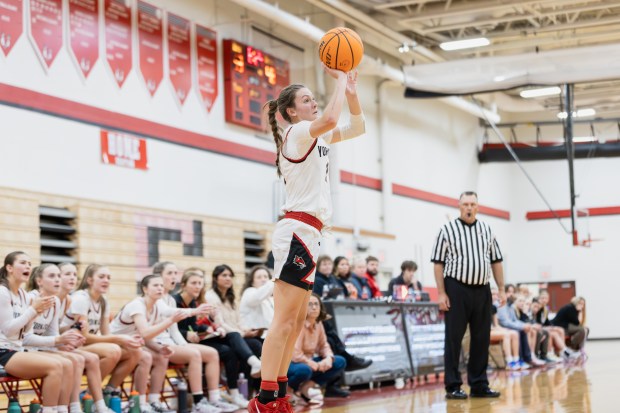 Yorkville's Lainey Gussman (12) shoots the ball against Oswego East during a Southwest Prairie Conference game in Yorkville on Thursday, Dec. 12, 2024. (Troy Stolt / for the Beacon News)