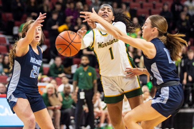 Waubonsie Valley's Arianna Garcia (1) gets a ball past Nazareth's Amalia Dray (25) and Mary Bridget Wilson during the Class 4A state semifinal game at CEFCU Arena in Normal on Friday, March 1, 2024. (Vincent D. Johnson / The Beacon-News)