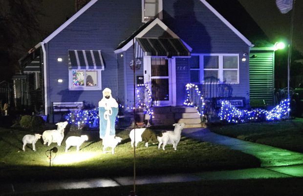 The annual Lehnertz Avenue Christmas display, which opened Sunday evening, features a variety of lawn signs, cutout figures, religious and secular characters and more. (David Sharos / For The Beacon-News)