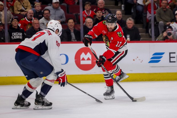 Chicago Blackhawks left wing Nick Foligno (17) tries to take a shot past Washington Capitals defenseman Trevor van Riemsdyk (57) during the first period at the United Center Tuesday Dec. 17, 2024, in Chicago. (Armando L. Sanchez/Chicago Tribune)