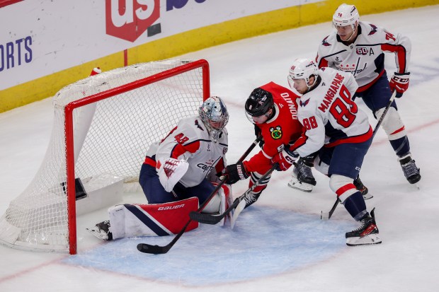 Chicago Blackhawks center Ryan Donato (8) scores a goal past Washington Capitals goaltender Logan Thompson (48) to give the Blackhawks a 3-2 lead during the third period at the United Center Tuesday Dec. 17, 2024, in Chicago. (Armando L. Sanchez/Chicago Tribune)