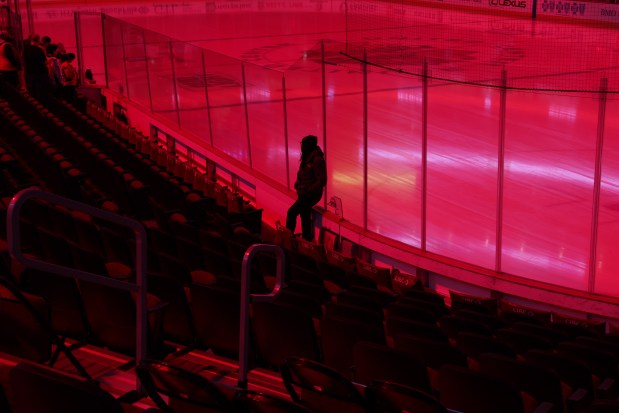 An employee stands against the ice before the Chicago Blackhawks play the Washington Capitals at the United Center Tuesday Dec. 17, 2024, in Chicago. (Armando L. Sanchez/Chicago Tribune)