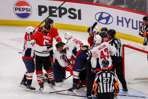 Chicago Blackhawks and Washington Capitals players fight during the third period at the United Center Tuesday Dec. 17, 2024, in Chicago. (Armando L. Sanchez/Chicago Tribune)