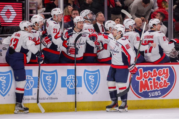 Washington Capitals left wing Andrew Mangiapane (88) celebrates with his team after scoring a goal during the first period against the Chicago Blackhawks at the United Center Tuesday Dec. 17, 2024, in Chicago. (Armando L. Sanchez/Chicago Tribune)