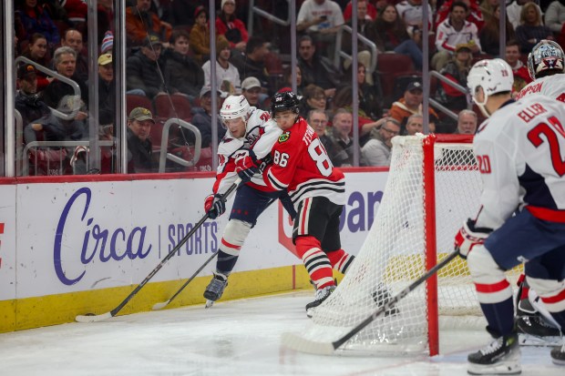 Chicago Blackhawks center Teuvo Teravainen (86) guards Washington Capitals defenseman John Carlson (74) while he handles the puck during the first period at the United Center Tuesday Dec. 17, 2024, in Chicago. (Armando L. Sanchez/Chicago Tribune)