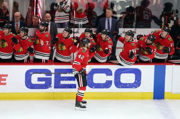 Blackhawks defenseman Nolan Allan (42) celebrates his first NHL goal in the third period against the Kraken at the United Center in Chicago on Dec. 19, 2024. (Terrence Antonio James/Chicago Tribune)