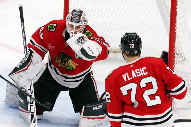 Blackhawks goaltender Arvid Soderblom (40) gloves the puck in the third period against the Kraken at the United Center in Chicago on Dec. 19, 2024. (Terrence Antonio James/Chicago Tribune)