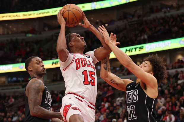 Bulls' Julian Phillips is defended by the Nets' Jalen Wilson during the second half at the United Center on Dec. 2, 2024.(Photo by Michael Reaves/Getty Images)