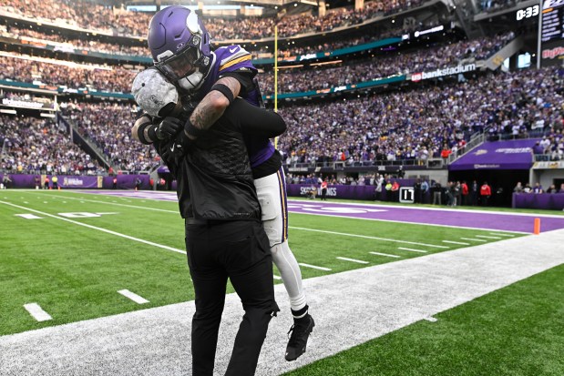 Vikings defensive coordinator Brian Flores hugs Byron Murphy Jr. during the fourth quarter against the Cardinals at U.S. Bank Stadium on Dec. 1, 2024. (Photo by Stephen Maturen/Getty Images)