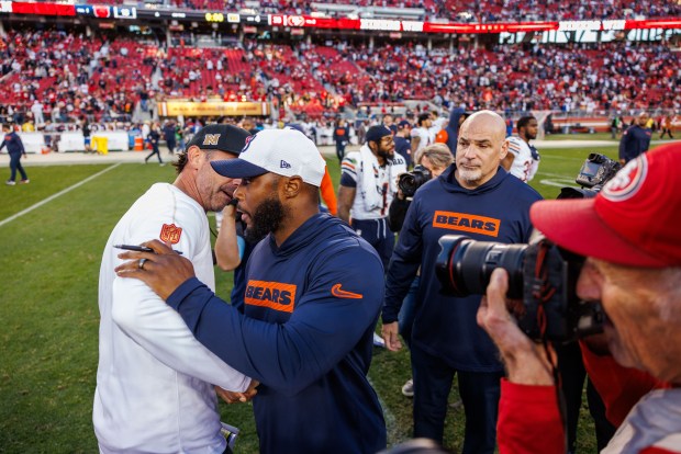 Bears interim coach Thomas Brown talks with 49ers coach Kyle Shanahan after the Bears lost 38-13 on Sunday, Dec. 8, 2024, at Levi's Stadium in Santa Clara, Calif. (Armando L. Sanchez/Chicago Tribune)