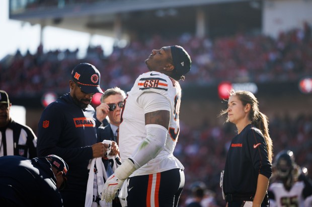 Bears defensive tackle Gervon Dexter Sr. talks with the medical staff after suffering a knee injury against the 49ers on Dec. 8, 2024, in Santa Clara, Calif. (Armando L. Sanchez/Chicago Tribune)