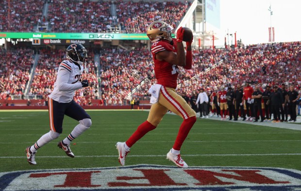 49ers wide receiver Jauan Jennings makes a touchdown reception as Bears cornerback Tyrique Stevenson chases in the first quarter at Levi's Stadium on Dec. 8, 2024. (John J. Kim/Chicago Tribune)