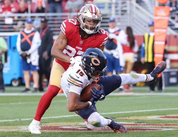 Bears wide receiver Rome Odunze (15) makes a touchdown reception as 49ers safety Ji'Ayir Brown (27) defends in the fourth quarter at Levi's Stadium on Dec. 8, 2024. (John J. Kim/Chicago Tribune)