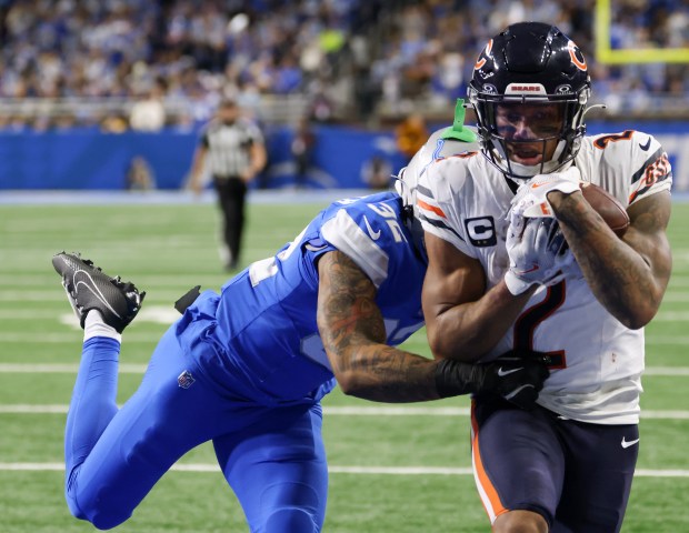 Bears wide receiver DJ Moore makes a touchdown reception as Lions safety Brian Branch covers in the fourth quarter at Ford Field on Nov. 28, 2024, in Detroit. (John J. Kim/Chicago Tribune)