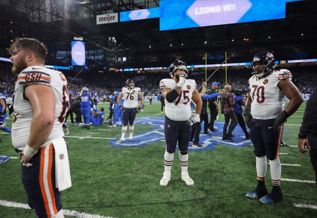 Bears offensive linemen stand on the field after losing 23-20 to the Lions at Ford Field on Nov. 28, 2024, in Detroit. (John J. Kim/Chicago Tribune)