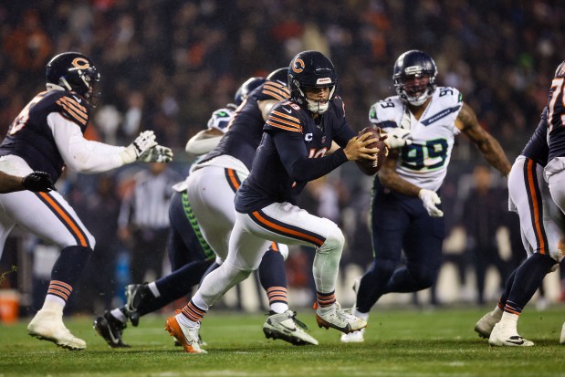 Bears quarterback Caleb Williams handles the ball during the third quarter against the Seahawks at Soldier Field on Dec. 26, 2024. (Armando L. Sanchez/Chicago Tribune)