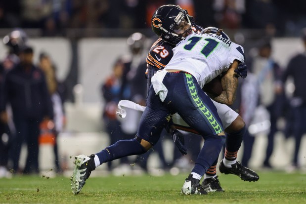 Bears cornerback Tyrique Stevenson tackles Seahawks wide receiver Jaxon Smith-Njigba during the fourth quarter at Soldier Field on Dec. 26, 2024. (Armando L. Sanchez/Chicago Tribune)