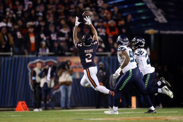 Chicago Bears wide receiver DJ Moore (2) gets a first down catch in the final minutes of the fourth quarter against the Seattle Seahawks at Soldier Field Thursday Dec. 26, 2024, in Chicago. (Armando L. Sanchez/Chicago Tribune)