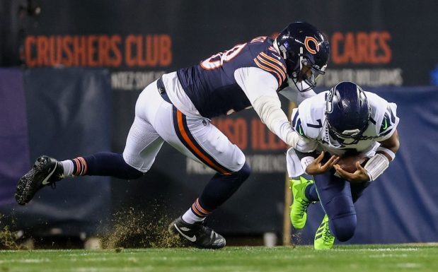 Bears defensive end Montez Sweat sacks Seahawks quarterback Geno Smith during the first quarter at Soldier Field on Dec. 26, 2024. (Armando L. Sanchez/Chicago Tribune)