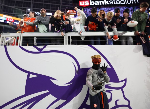 Bears cornerback Kyler Gordon (6) takes a selfie with fans at U.S. Bank Stadium on Dec. 16, 2024, in Minneapolis. (Stacey Wescott/Chicago Tribune)