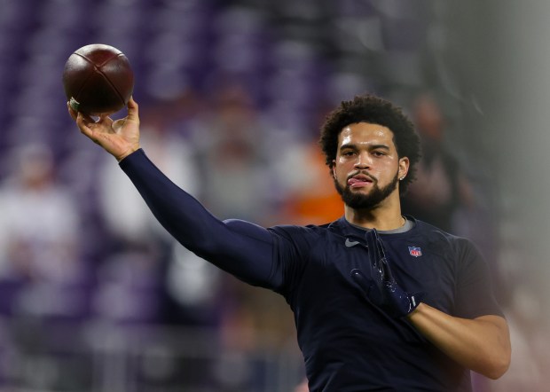 Chicago Bears quarterback Caleb Williams (18) warms up  at U.S Bank Stadium before the start of  a game against the Minnesota Viking. (Stacey Wescott/Chicago Tribune)