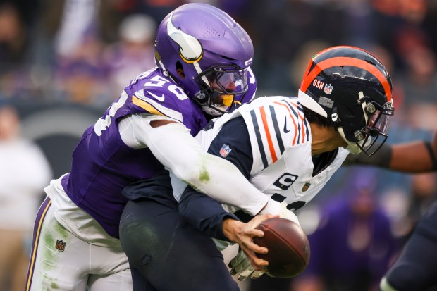 Vikings linebacker Jonathan Greenard sacks Bears quarterback Caleb Williams in overtime on Nov. 24, 2024, at Soldier Field. (Eileen T. Meslar/Chicago Tribune)