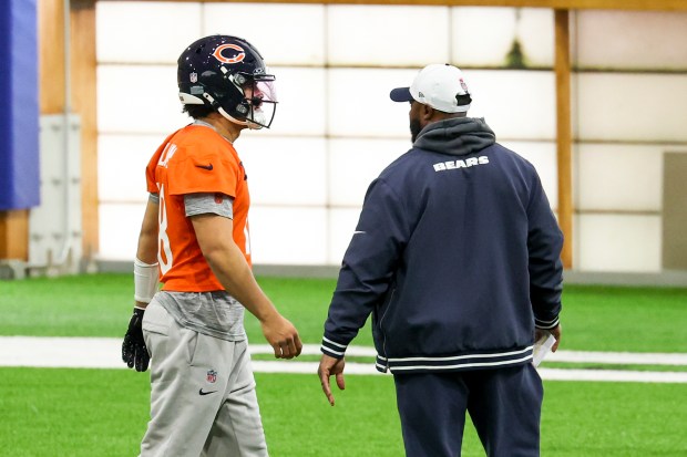 Bears interim coach Thomas Brown speaks with quarterback Caleb Williams during practice at Halas Hall on Dec. 4, 2024, in Lake Forest. (Eileen T. Meslar/Chicago Tribune)