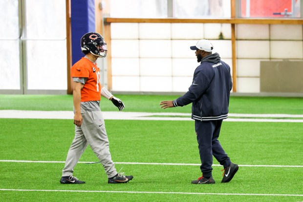 Chicago Bears interim head coach Thomas Brown speaks to Chicago Bears quarterback Caleb Williams during practice at Halas Hall in Lake Forest on Wednesday, Dec. 4, 2024. (Eileen T. Meslar/Chicago Tribune)